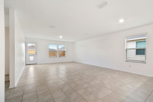 unfurnished room with light tile patterned floors