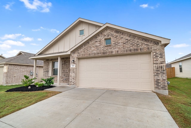 view of front of house with a front lawn and a garage