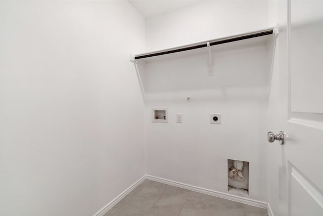 clothes washing area with washer hookup, electric dryer hookup, hookup for a gas dryer, and light tile patterned floors