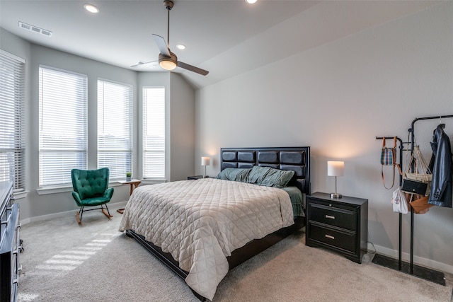 carpeted bedroom featuring ceiling fan and vaulted ceiling