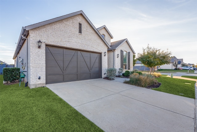 view of front of home featuring a garage and a front yard