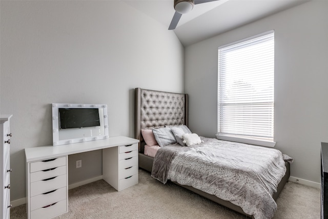 bedroom with ceiling fan, multiple windows, lofted ceiling, and light carpet