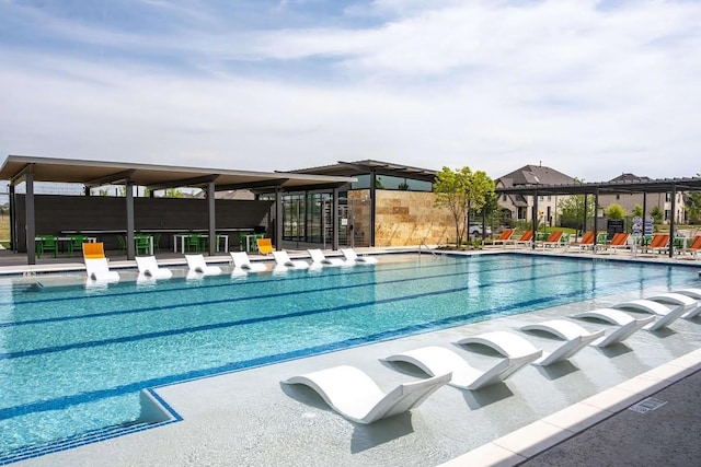 view of swimming pool with a patio