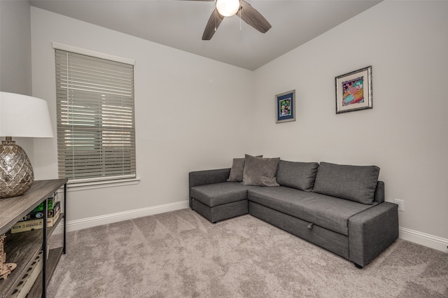 carpeted living room featuring ceiling fan