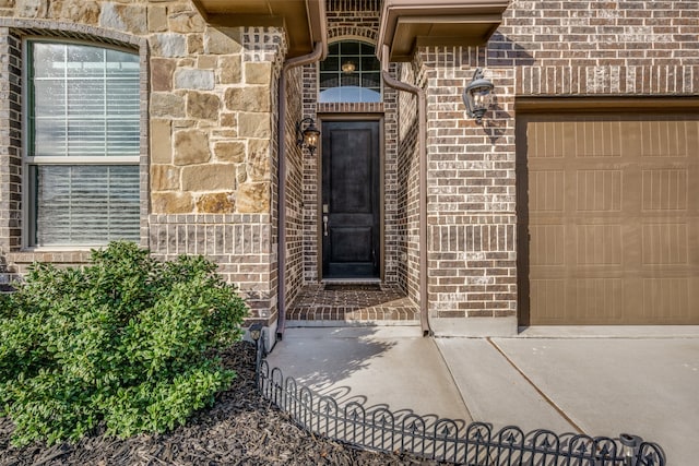 entrance to property featuring a garage