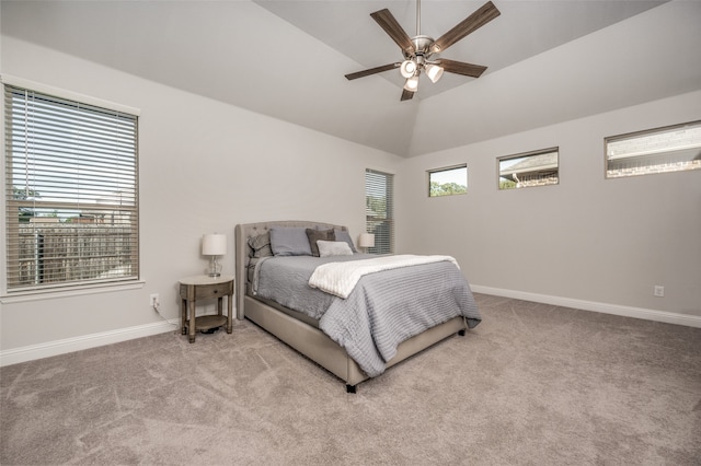 carpeted bedroom with vaulted ceiling and ceiling fan