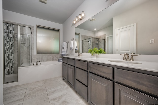 bathroom featuring vanity and shower with separate bathtub