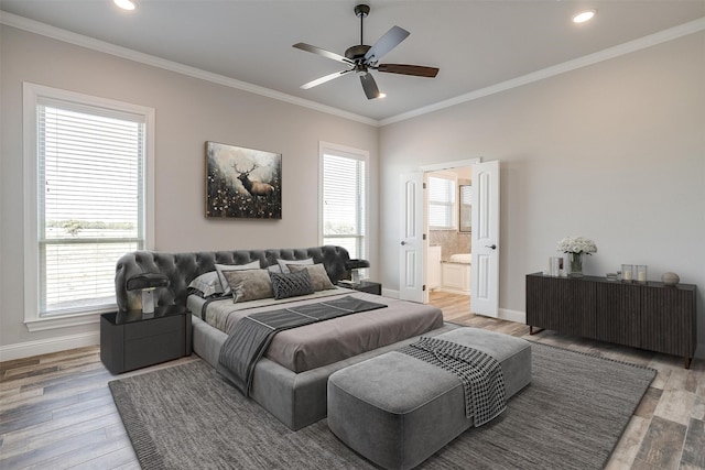 bedroom with hardwood / wood-style flooring, ceiling fan, ornamental molding, and ensuite bathroom