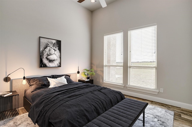 bedroom featuring light hardwood / wood-style flooring and ceiling fan