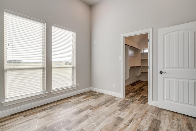 unfurnished room with light wood-type flooring