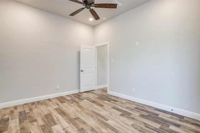 unfurnished room with ceiling fan and light wood-type flooring