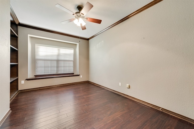 empty room with ceiling fan, dark hardwood / wood-style floors, and crown molding