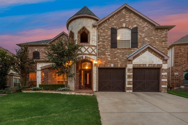 french country style house with a garage and a yard