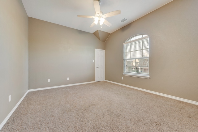 unfurnished room with ceiling fan, vaulted ceiling, and carpet floors