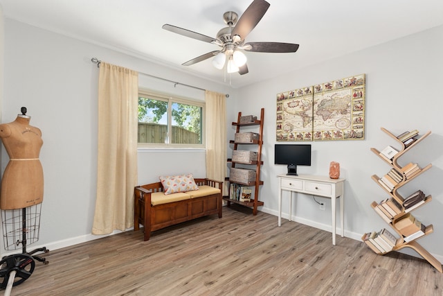 bedroom with a walk in closet, ensuite bathroom, ceiling fan, hardwood / wood-style floors, and a closet