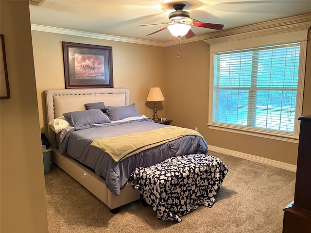 bedroom with ornamental molding, carpet, and ceiling fan