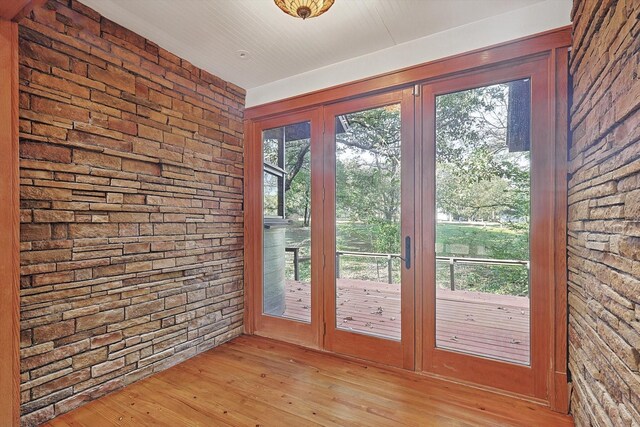 doorway to outside featuring light wood-type flooring and french doors