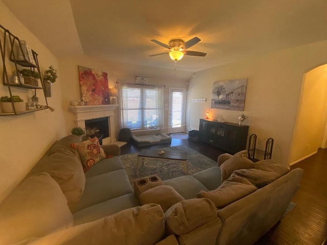 living room with dark hardwood / wood-style floors and ceiling fan