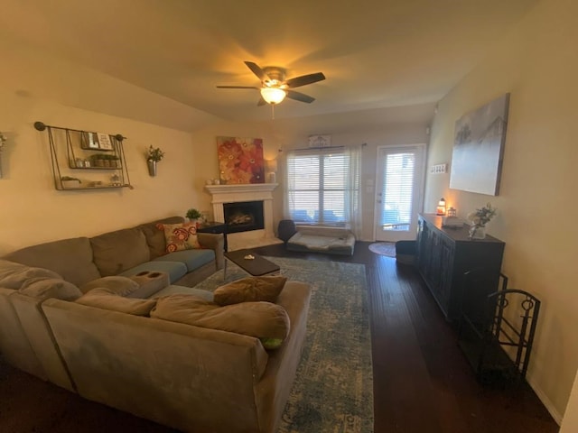 living room with dark hardwood / wood-style flooring and ceiling fan