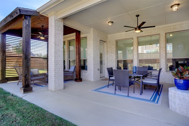 view of patio featuring ceiling fan