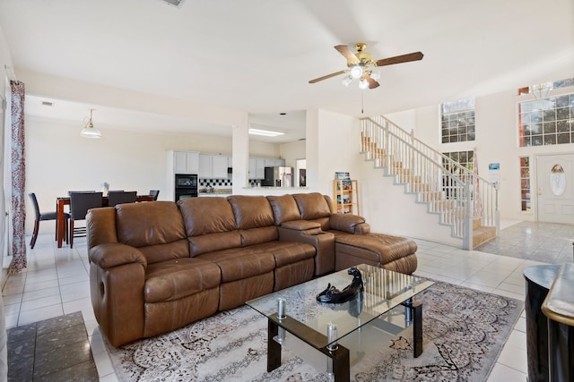 living room with ceiling fan and light tile patterned floors