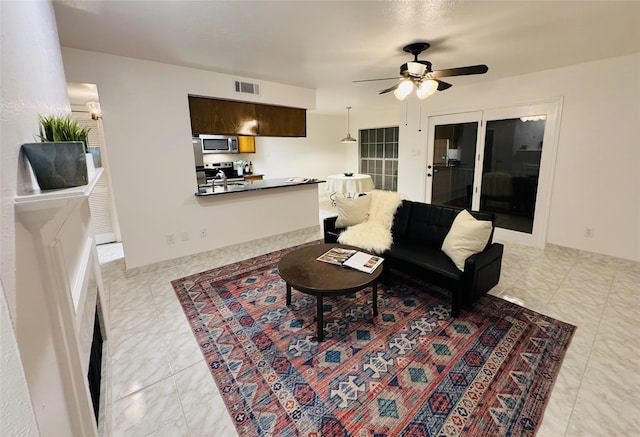 living room with ceiling fan