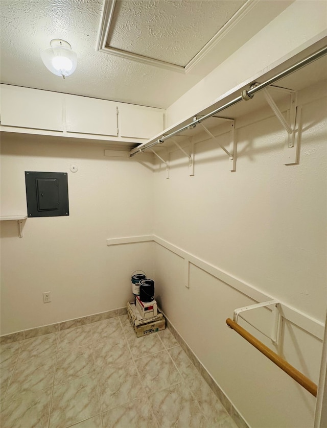 walk in closet featuring electric panel