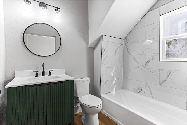 bathroom with toilet, vaulted ceiling, wood finished floors, and vanity