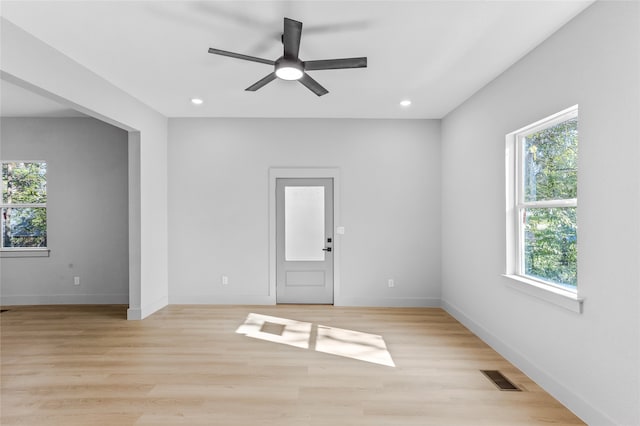 spare room with light wood-style floors, baseboards, visible vents, and recessed lighting