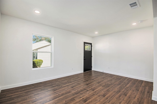 unfurnished room with dark hardwood / wood-style floors