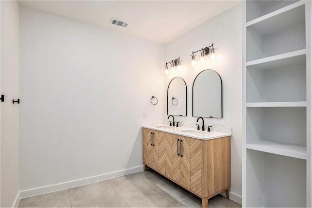 bathroom featuring tile patterned floors and vanity