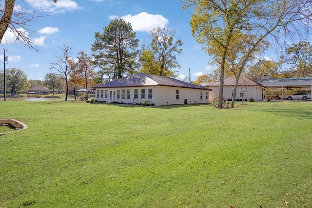 view of yard with a carport