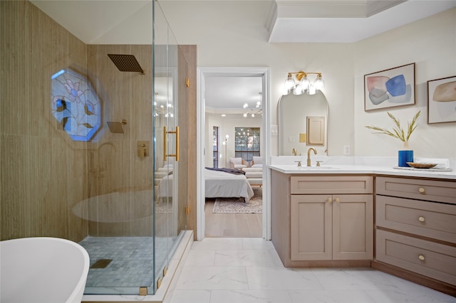 bathroom featuring vanity, crown molding, independent shower and bath, and a chandelier