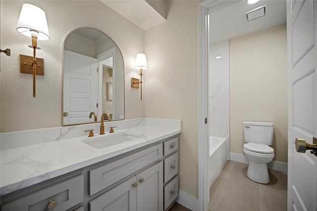 full bathroom featuring tile patterned floors, vanity, shower / bath combination, and toilet