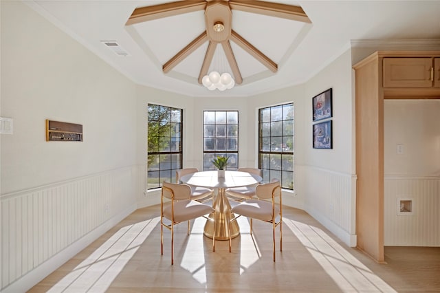 dining room featuring light hardwood / wood-style flooring, plenty of natural light, and ornamental molding