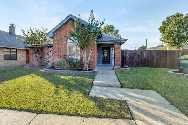 view of front of property with a front lawn