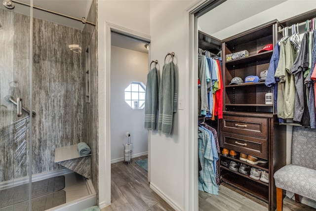 spacious closet featuring light hardwood / wood-style flooring