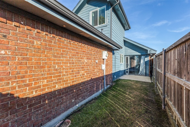 view of side of home featuring a patio