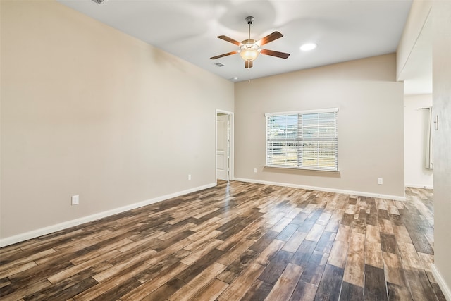 empty room with hardwood / wood-style floors and ceiling fan