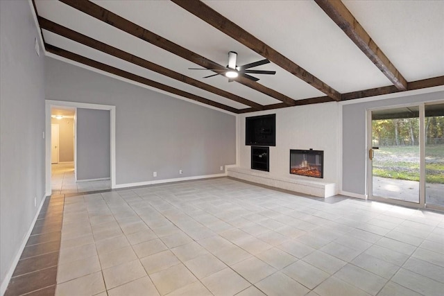 unfurnished living room with light tile patterned floors, a glass covered fireplace, baseboards, and ceiling fan