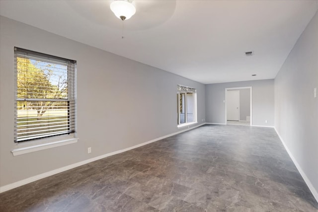 unfurnished room with ceiling fan