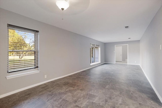 spare room with visible vents and baseboards