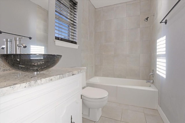 full bath with tile patterned floors, shower / bathtub combination, toilet, and vanity