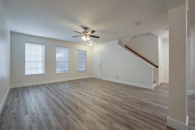 unfurnished living room with ceiling fan and light hardwood / wood-style floors