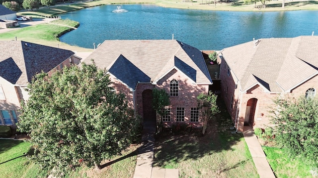 drone / aerial view with a water view