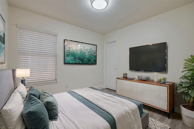 bedroom featuring light wood-style floors