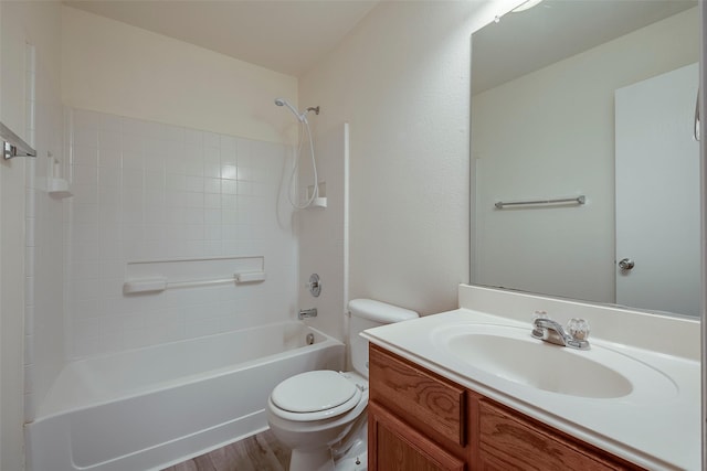 full bathroom featuring shower / tub combination, vanity, toilet, and wood finished floors