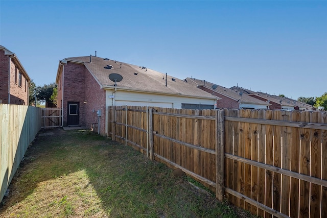 view of yard with a fenced backyard