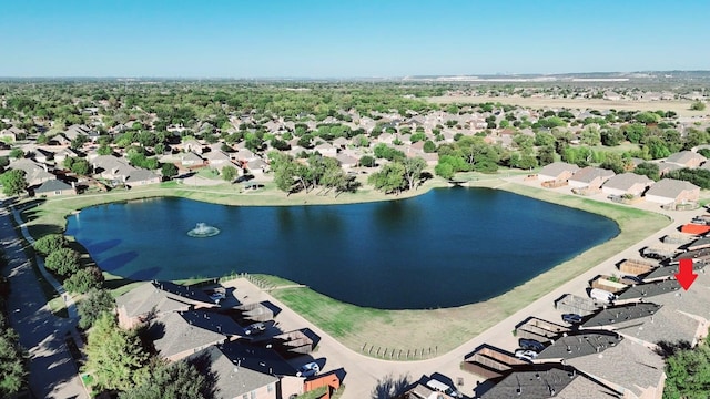 birds eye view of property featuring a residential view and a water view