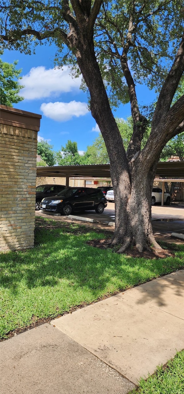 view of parking featuring a carport